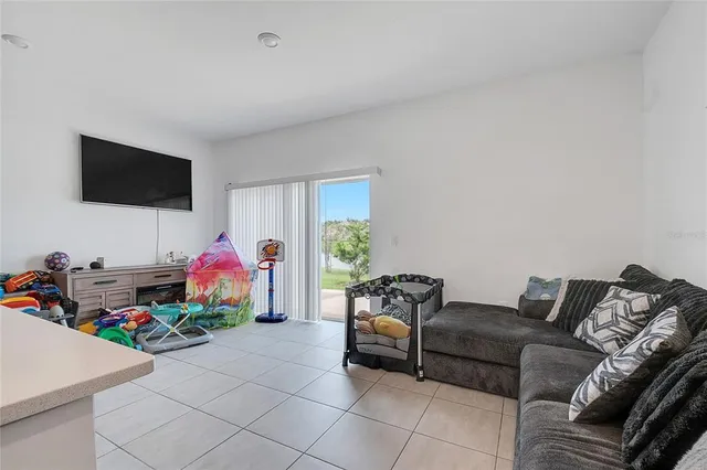 a bathroom with a sink a stove and a shelf