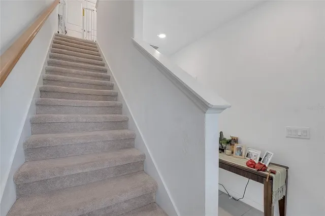 a view of a livingroom with tub and couch