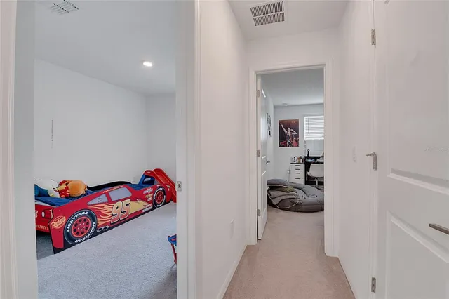 a view of a livingroom with workspace and a couch