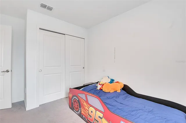 an aerial view of a house with a lake view