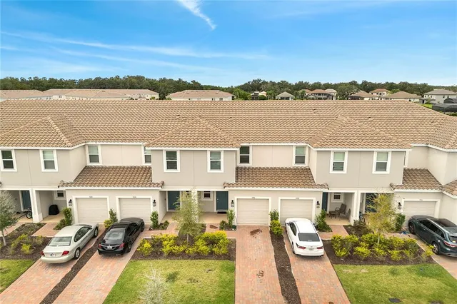 a bathroom with a glass shower door and a window