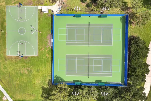 an aerial view of a house with swimming pool garden and patio
