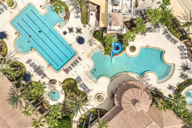 an aerial view of a house with a lake view