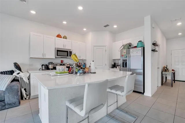 a view of a kitchen with sink and natural light