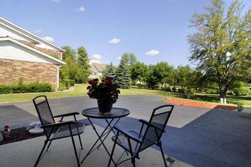 284 Paddock Circle Glendale Heights, IL 60139 - Photo 2 of 11 a swimming pool with outdoor seating and plants