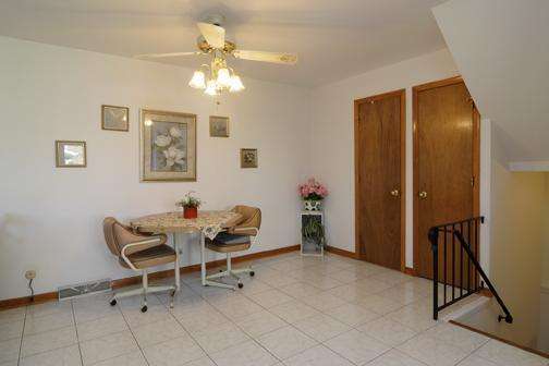 284 Paddock Circle Glendale Heights, IL 60139 - Photo 9 of 11 a dining room with furniture and a chandelier fan