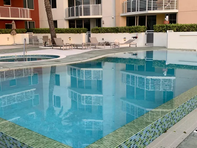a view of a kitchen with a sink and cabinets