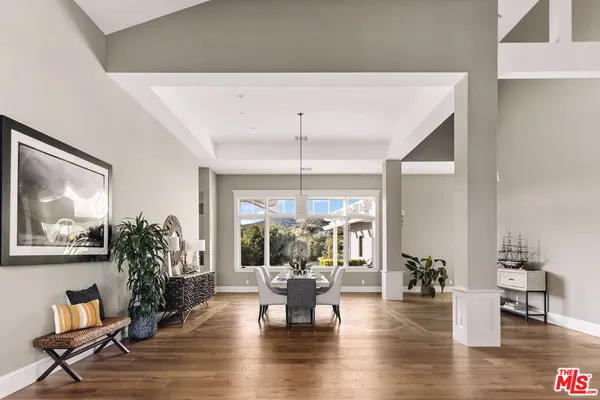a living room with fireplace furniture and a flat screen tv