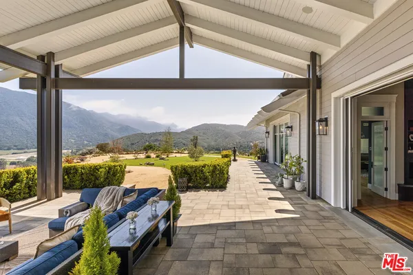 a view of a car park in front of house