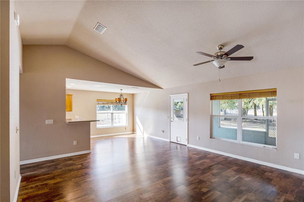 4495 Southeast 150th Street Summerfield, FL 34491 - Photo 11 of 76 wooden floor in an empty room with a window
