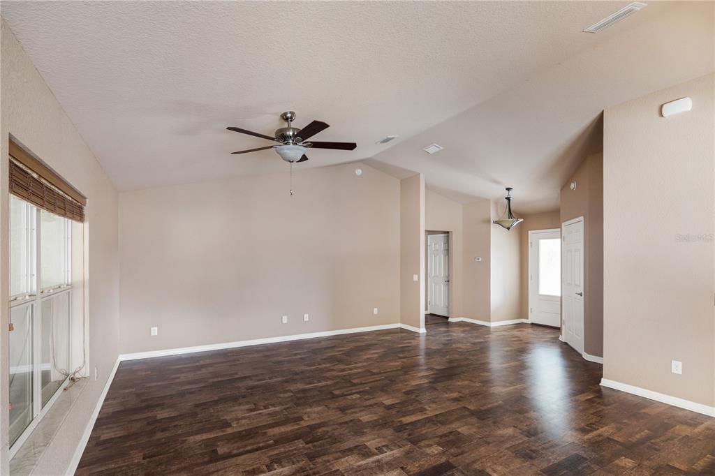 4495 Southeast 150th Street Summerfield, FL 34491 - Photo 17 of 76 a view of a livingroom with a ceiling fan and window