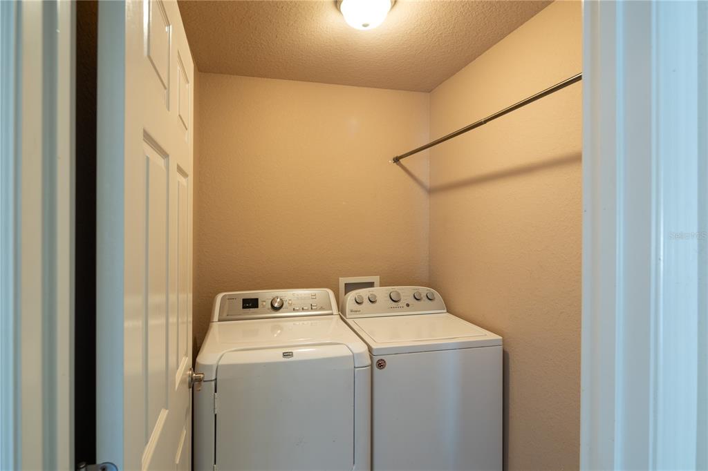4495 Southeast 150th Street Summerfield, FL 34491 - Photo 25 of 76 a utility room with dryer and washer