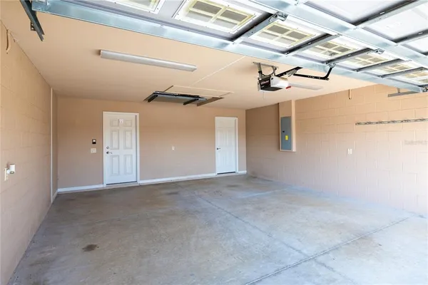 a view of an empty room with wooden walls