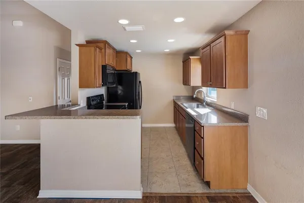 a view of an empty room with wooden walls