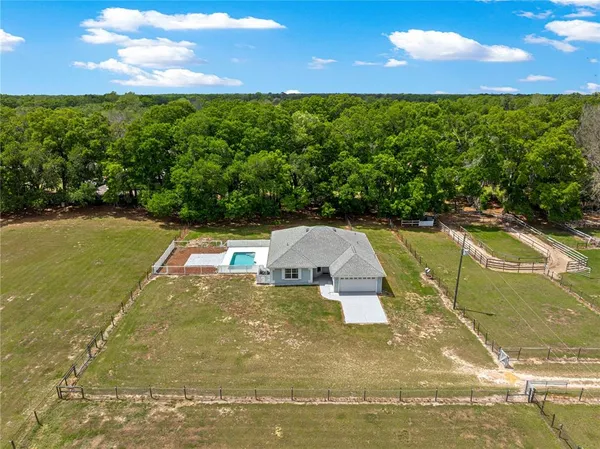 a view of a golf course with a swimming pool