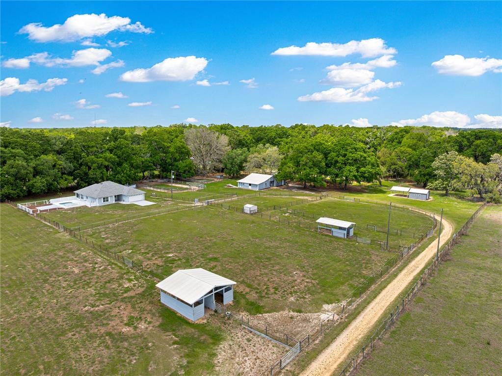 4495 Southeast 150th Street Summerfield, FL 34491 - Photo 33 of 76 a view of a big room with a swimming pool and outdoor space