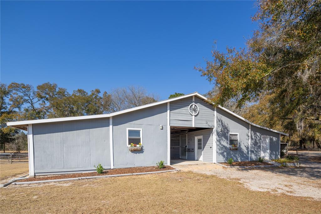 4495 Southeast 150th Street Summerfield, FL 34491 - Photo 37 of 76 a view of a house with a yard