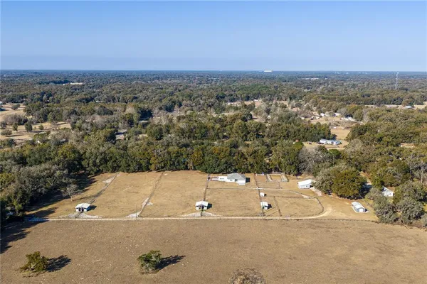 an aerial view of a house having yard