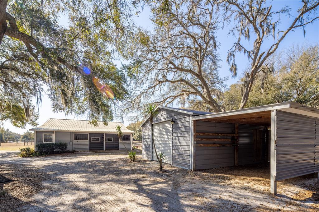 4495 Southeast 150th Street Summerfield, FL 34491 - Photo 47 of 76 a front view of a house with yard