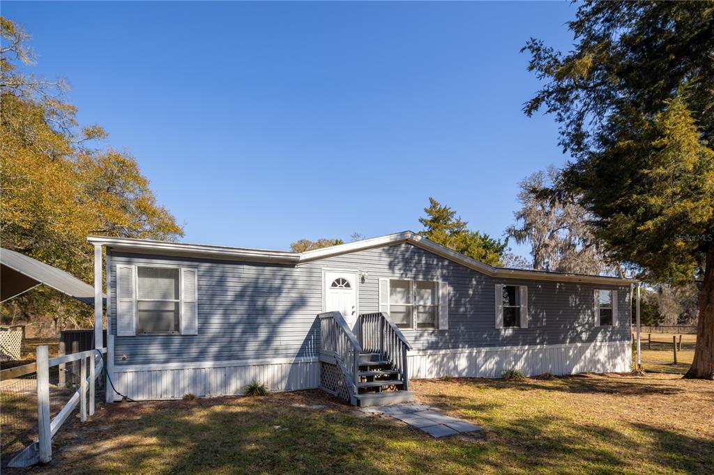 4495 Southeast 150th Street Summerfield, FL 34491 - Photo 56 of 76 a view of a house with a patio