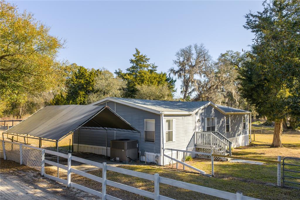 4495 Southeast 150th Street Summerfield, FL 34491 - Photo 57 of 76 a front view of house with yard