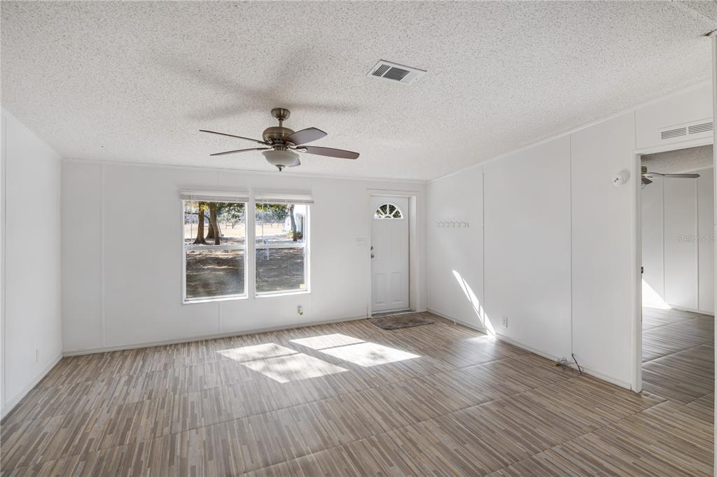 4495 Southeast 150th Street Summerfield, FL 34491 - Photo 58 of 76 wooden floor in an empty room with a window