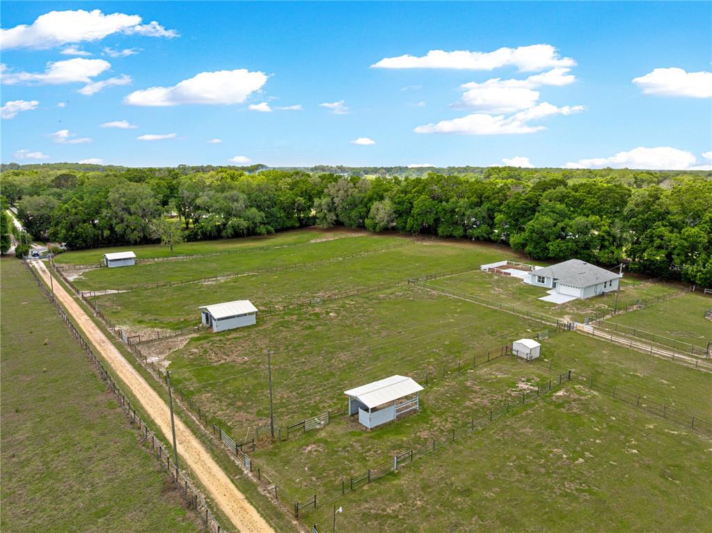 4495 Southeast 150th Street Summerfield, FL 34491 - Photo 6 of 76 a view of a golf course with a swimming pool