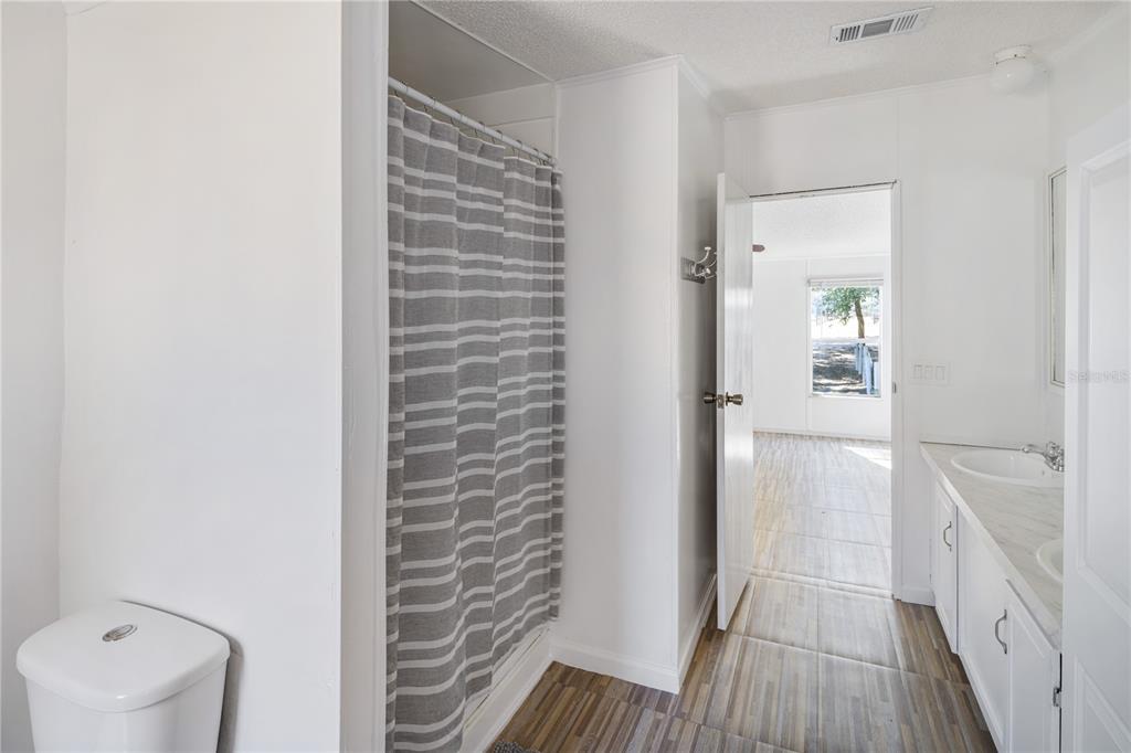 4495 Southeast 150th Street Summerfield, FL 34491 - Photo 65 of 76 a bathroom with a sink and a toilet