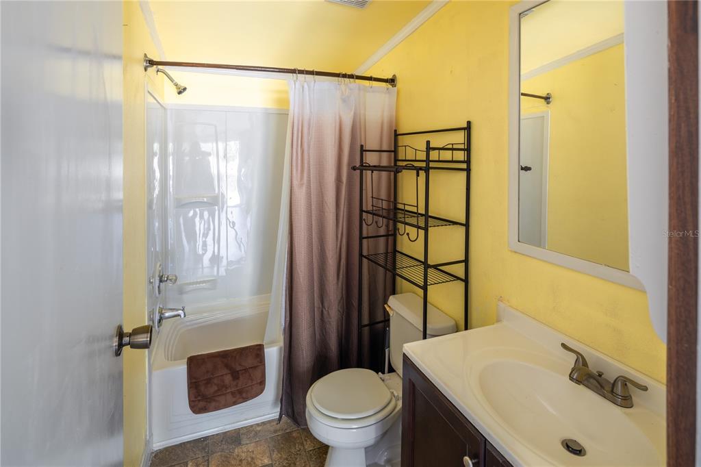 4495 Southeast 150th Street Summerfield, FL 34491 - Photo 68 of 76 a bathroom with a sink toilet and shower