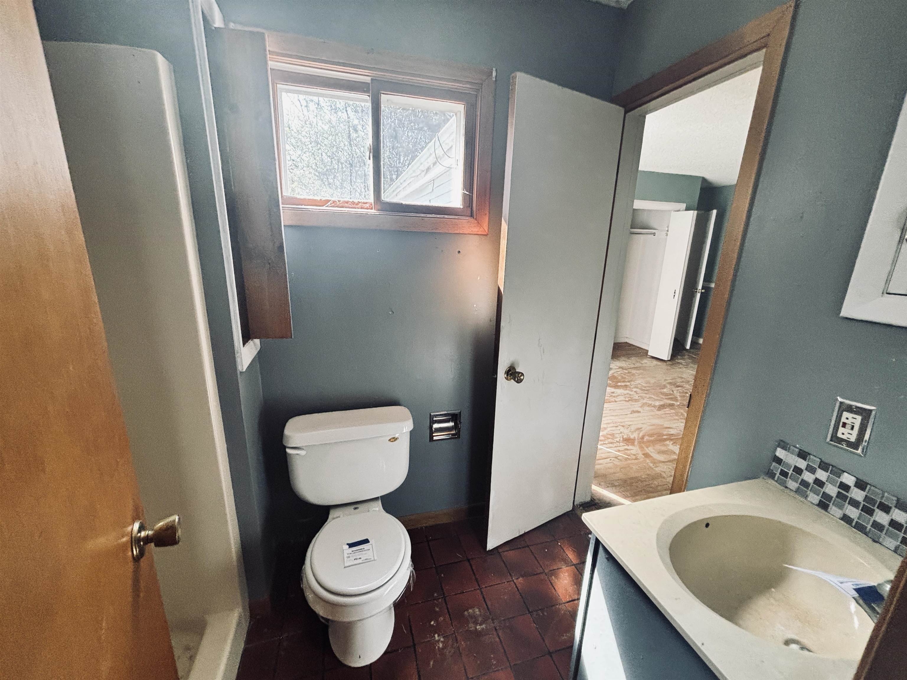 1331 West Logan Street Freeport, IL 61032 - Photo 12 of 30 a bathroom with a toilet and a sink