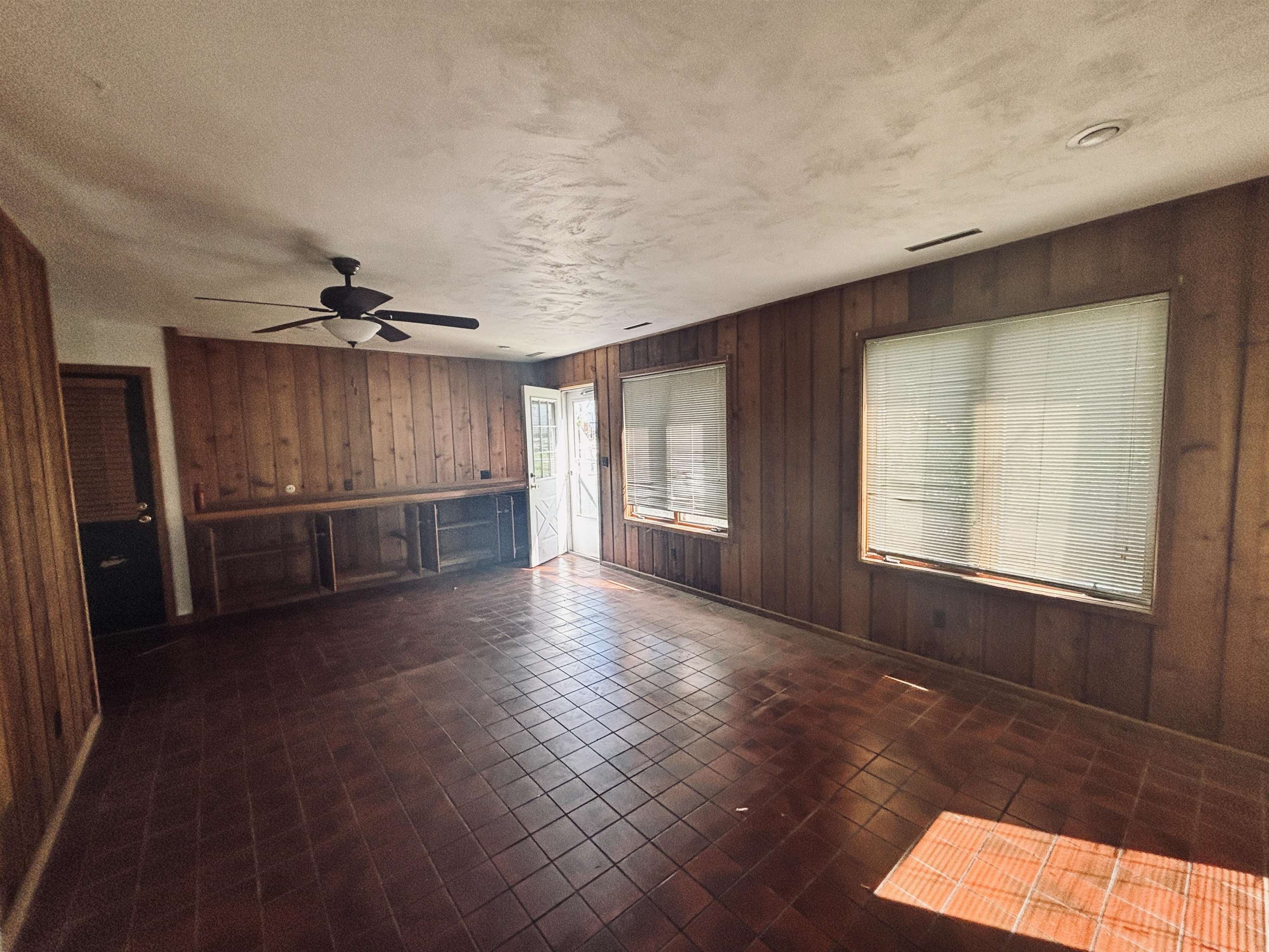 1331 West Logan Street Freeport, IL 61032 - Photo 13 of 30 wooden floor in an empty room with a window