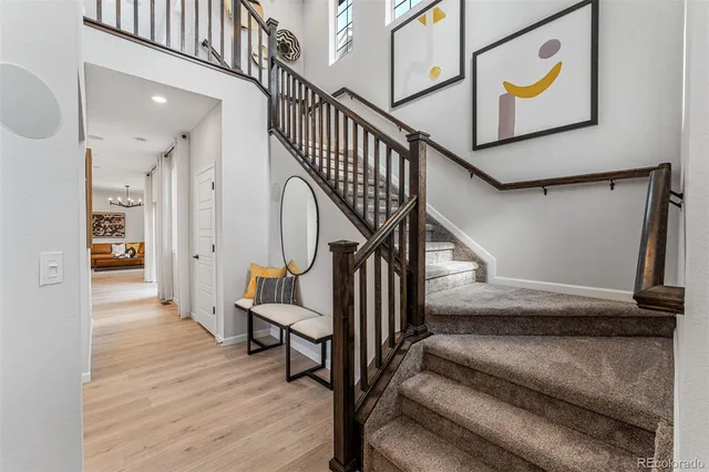 a view of staircase with wooden floor and a window