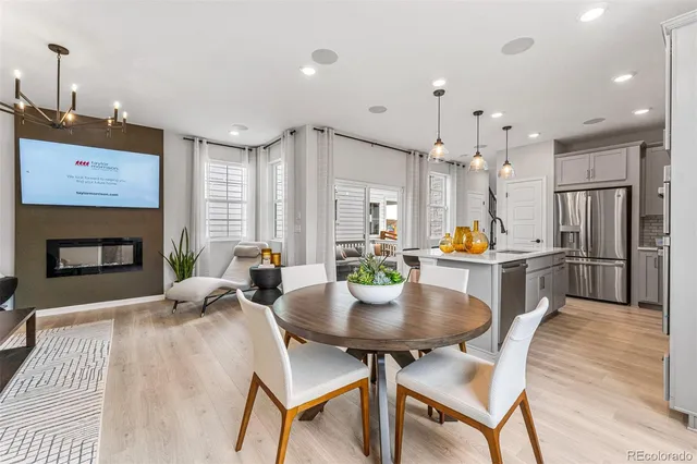 a kitchen that has a lot of cabinets and appliances