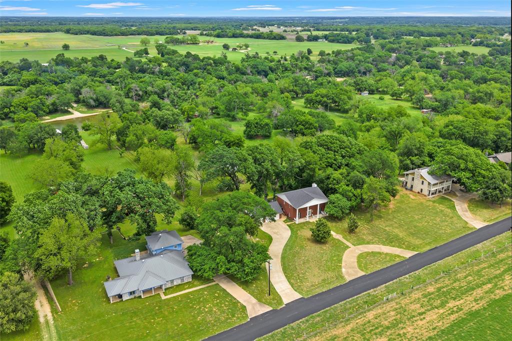 743 Stillwater Road Waco, TX 76708 - Photo 2 of 40 a view of a garden with an outdoor space