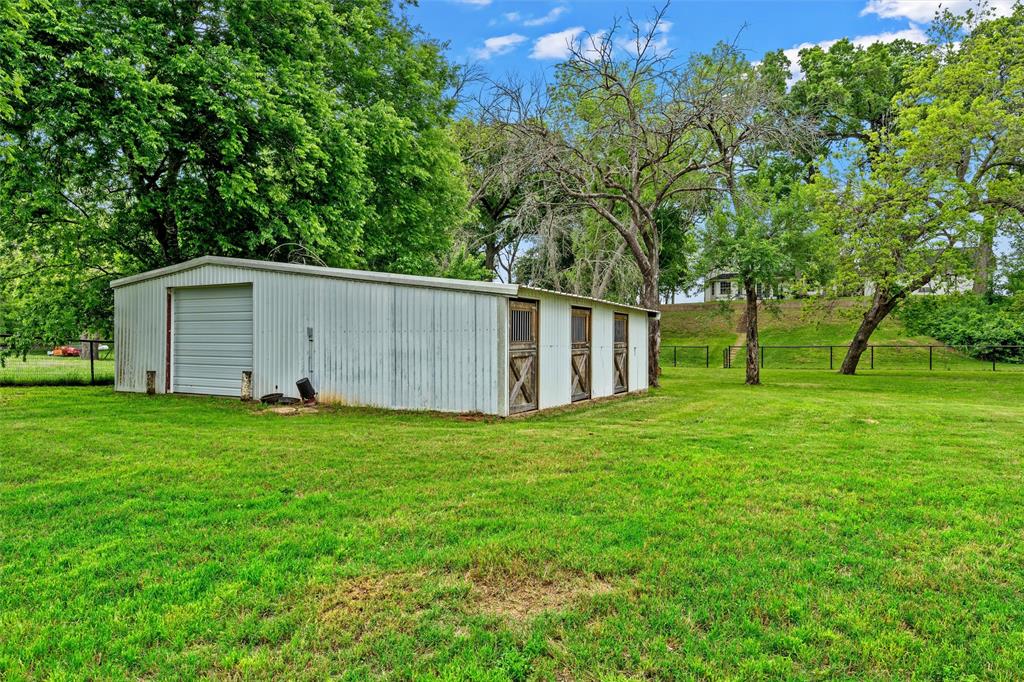 743 Stillwater Road Waco, TX 76708 - Photo 34 of 40 a backyard of a house with lots of green space