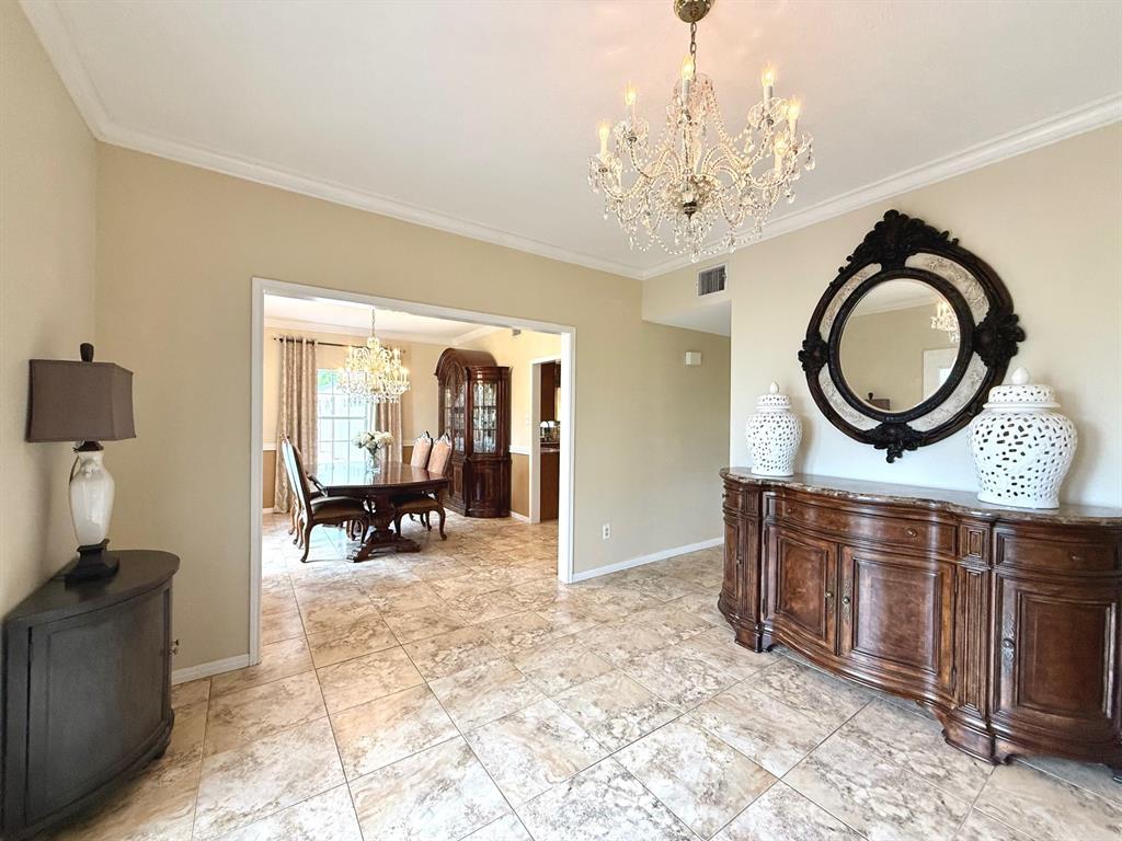 743 Stillwater Road Waco, TX 76708 - Photo 6 of 40 a view of a livingroom with furniture and a chandelier