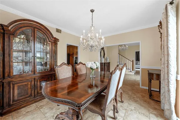 a dining room with furniture window and outside view