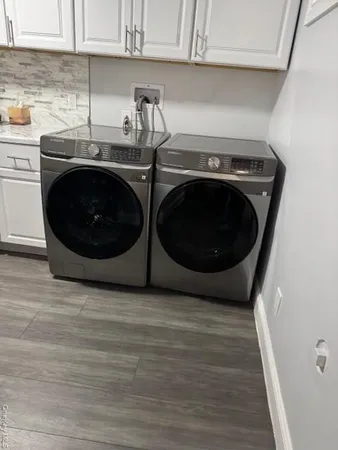 a kitchen with a sink a stove and cabinets