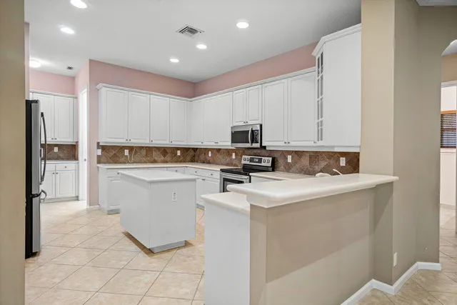 an aerial view of residential houses with outdoor space and street view