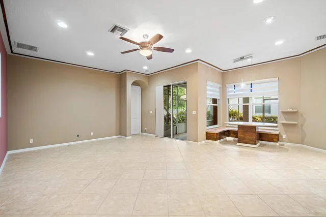 an aerial view of a house with a garden and lake view