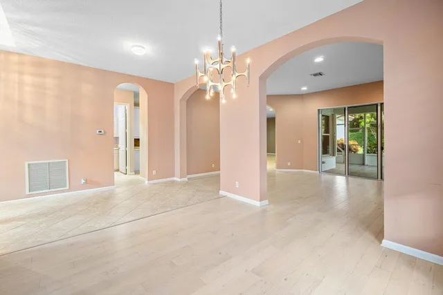 a bathroom with a sink a large mirror and a bathtub