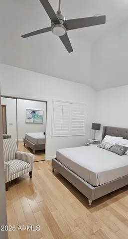 a bedroom with a bed and a couch