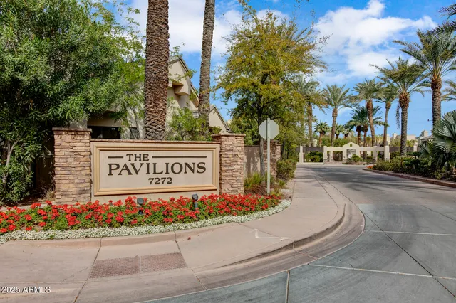 a street sign on a pole on a street