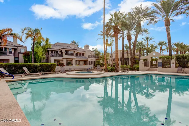 a view of a swimming pool with a patio