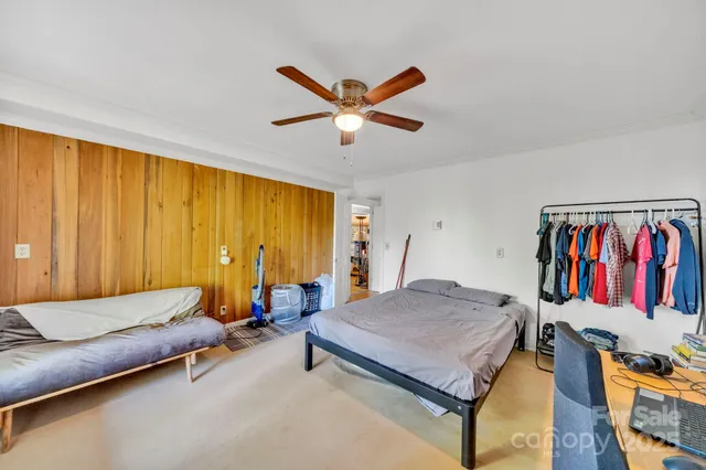 a kitchen with stainless steel appliances granite countertop a sink a stove a refrigerator with a dining table and chairs