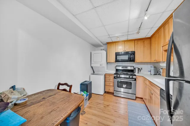 a white toilet sitting next to a bath tub