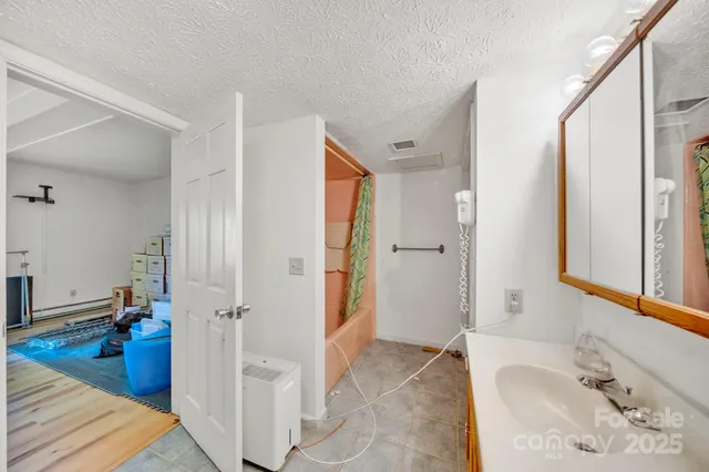 a view of balcony with wooden floor and fence