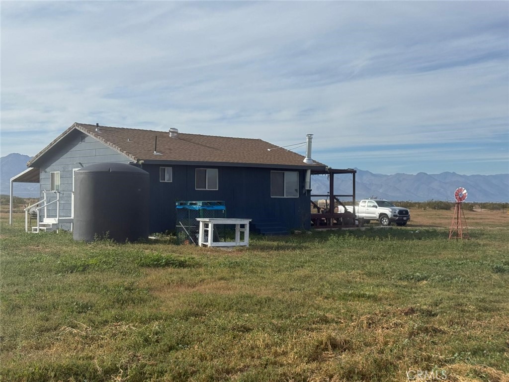 1320 Jacks Ranch Road Ridgecrest, CA 93555 - Photo 13 of 18 a front view of a house with garden