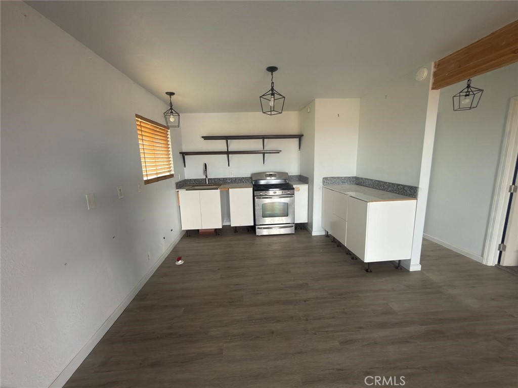 1320 Jacks Ranch Road Ridgecrest, CA 93555 - Photo 4 of 18 a view of a kitchen from the hallway