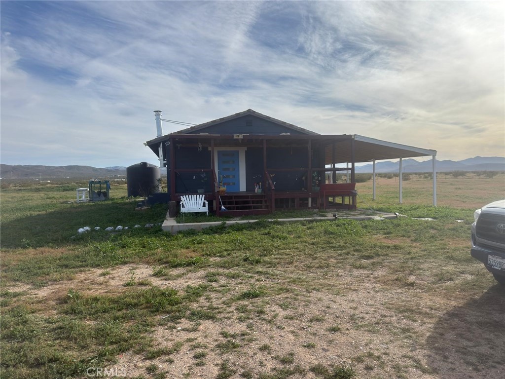 1320 Jacks Ranch Road Ridgecrest, CA 93555 - Photo 10 of 18 a view of a house with a yard